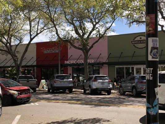 Front of building.  They are in the pink one.