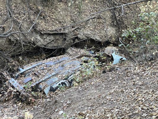 Overturned car in the ravine.