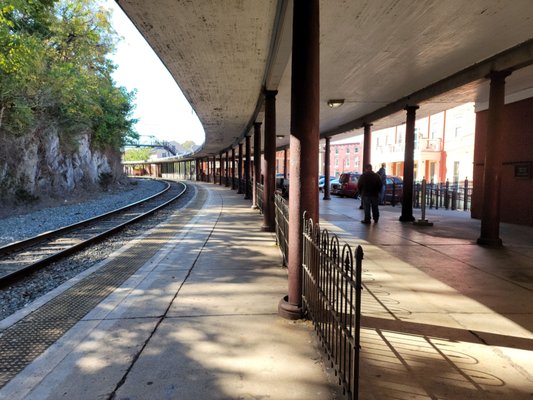 The platform. Waiting room is open erratically. Don't count on it being open. Unstaffed station.