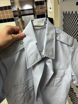 Wrinkled/messed up short sleeve light blue shirt