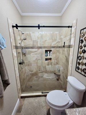 Frameless glass serenity shower black hardware