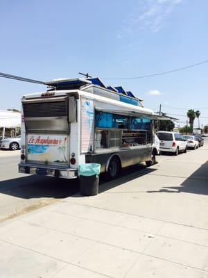 Taco truck near auto glass business!