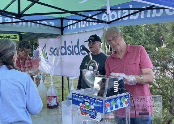 SoundSide volunteers, handing out snacks at an event.