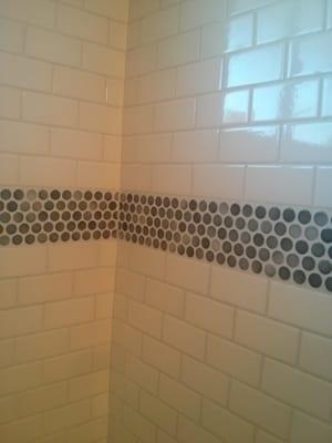 subway tile with penny mosaic accent