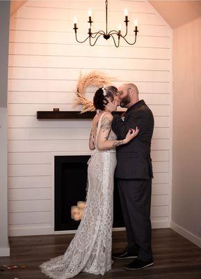 Bride & Groom Kissing at Fly the Coop Studio in Coeur d'Alene, ID - Photos by Codie Leigh Photography