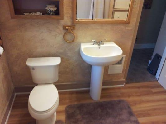 This bathroom turned out beautiful from the floor to the textured walls and exquisite paint job