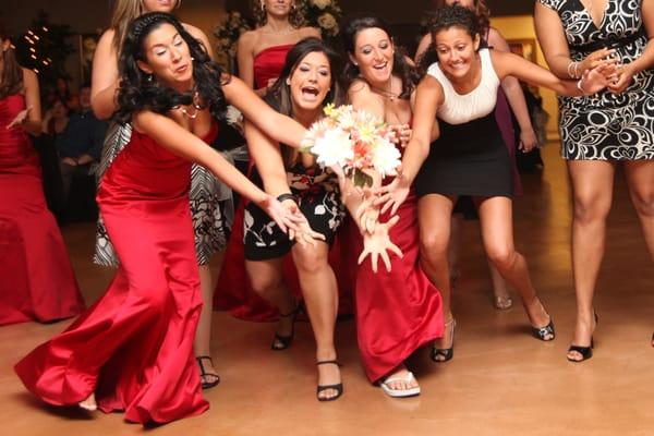 Ladies going for the bouquet toss!