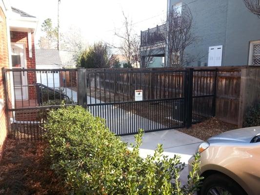 6 ft rod iron fence and gate poodle proof (custom build) with electric gate opener.