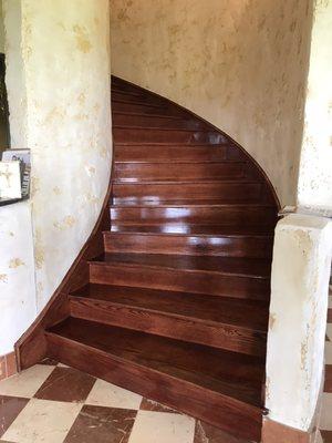 Here we have a staircase that was given a coat of stain and clear coat for that bright shiny look