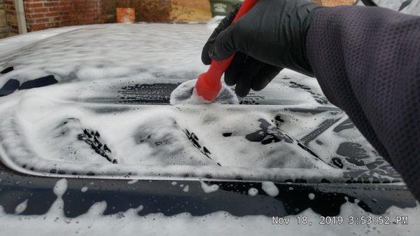 We use ultra soft detail brushes to remove dirt around badges, grills, door handles and any other locations where a mitt may not fit.