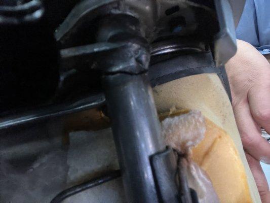 Severed rod under driver seat