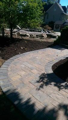 A circular walkway makes a nice home a fabulous home.  Call us for a free quote.