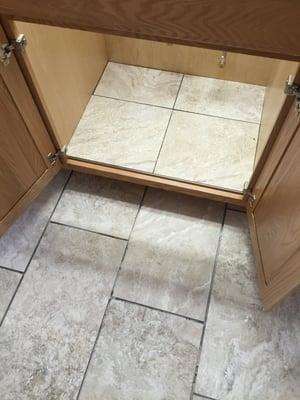 Bathroom floor and vanity base, still needs grouted at this point.