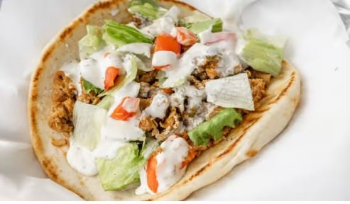 Chicken Gyro:
Grilled Chicken and Salad in toasted pita topped with homemade Taziki sauce (White Sauce)