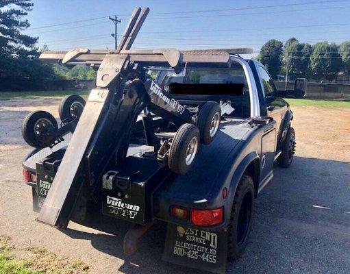 Auto loaded truck with dolly wheels