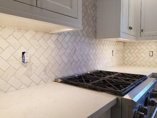 Herringbone pattern with polished marble and unpolished marble....See the sparkle, very modern and clean.