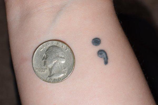 (With flash and size comparison) Semi-colon by Derek of "Tattoos by Derek." Date received in mid-May of 2018. Picture taken May 30, 2019.