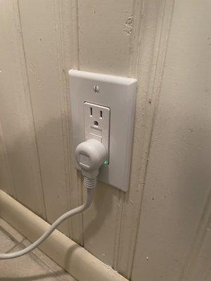 New electrical plug installed in bathroom.