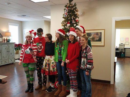 A local youth group of carolers comes by for afternoon entertainment.