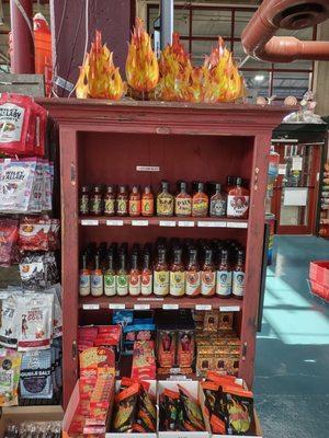 HOT STUFF.  We carry a large selection of local made hot sauces and spicy candy.