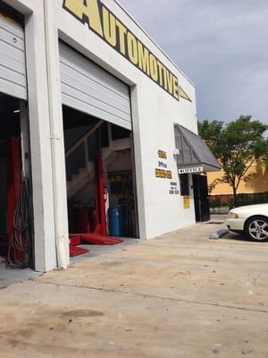 Front view of the entrance and garage bays.