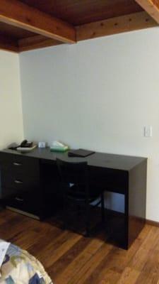 Big desk. Lots of room for laptop and paperwork.  Could have used a lamp. ..but not a big deal