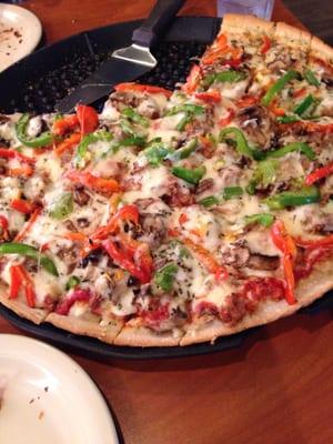 Large Sausage mushroom and green pepper pizza... So good!! Thin crust and generous toppings!!