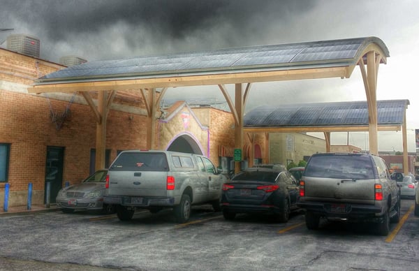 Parking out front is shaded with... SOLAR PANELS! Let's hear it for the Bush going green.