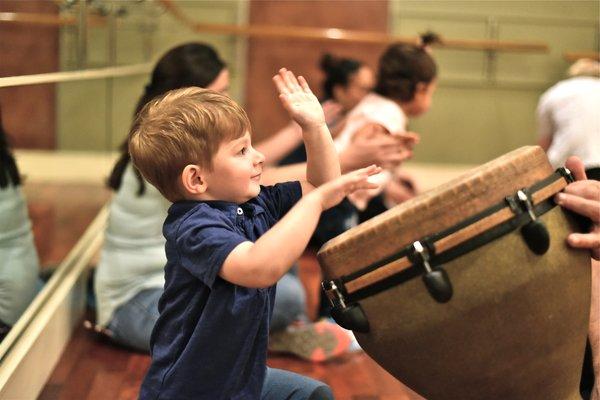 Taking a turn on the djembe drum!