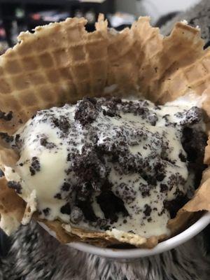 French vanilla ice cream with brownie in a waffle bowl to go