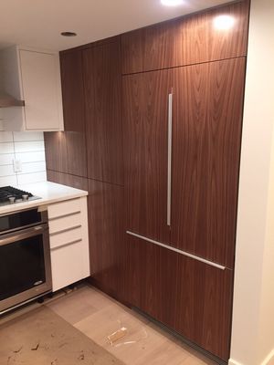 Installed IKEA kitchen frames with custom doors and fridge raider panels for a built-in switching in Hell's Kitchen New York