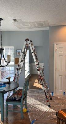 Repairing ceiling drywall after a leak was repaired