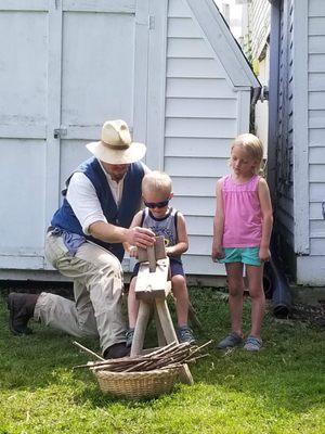 Wood carving demonstration at the Laura Days festivities in Burr Oak, Iowa.