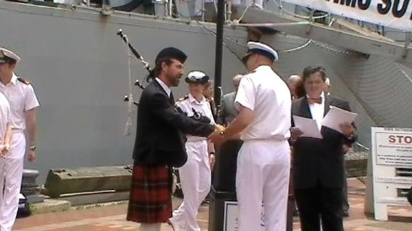 HMS Sutherland's Commanding Officer, Commander John D. Payne