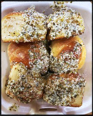 Garlic knots perfectly toasted and smothered in butter and garlic ( seasonings).