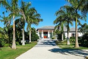 Gorgeous British West Indies Bayfront Estate on Longboat Key Fl. with beach access and guest house on Property