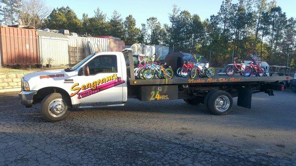 Donating bicycle's to children in need in the Hytech Christmas parade to Ameila County.