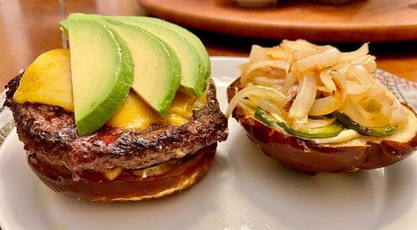 Angus chuck burger on a pretzel bun