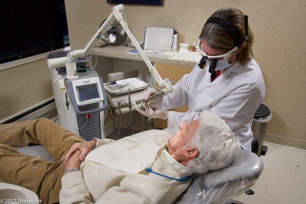 Dr. Wolff informing a patient how our laser technology works.