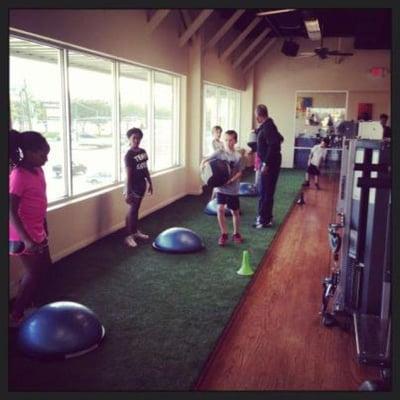 Boys and girls engaged in speed and agility camp. It is held indoors on our turf.