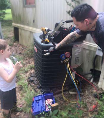 Clynt training our youngest HVAC Technician, Jax.