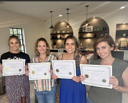 Myself and fellow graduates getting our Certification of completion of the Microblading Artist Course at GiacMicro Academy Aug 2023