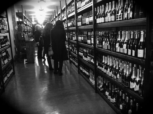 Rows of fine wines in Adega Wines and Spirits.