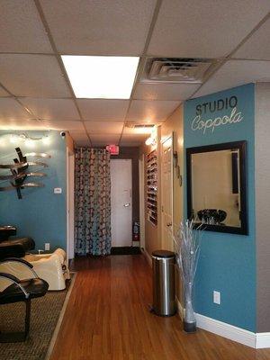 Our pedicure area and are nail polish wall.