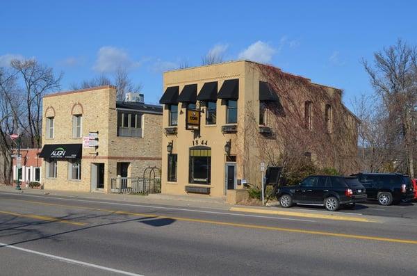 The old Long Lake bank building in 1905.  (with black awnings)               Photographed by Ken Siljander Nov. 7, 2015