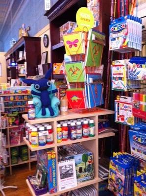 Good shot inside the shop - original tin ceilings, wooden floors, wainscot walls.  Seen You've Got Mail? That's the vibe.