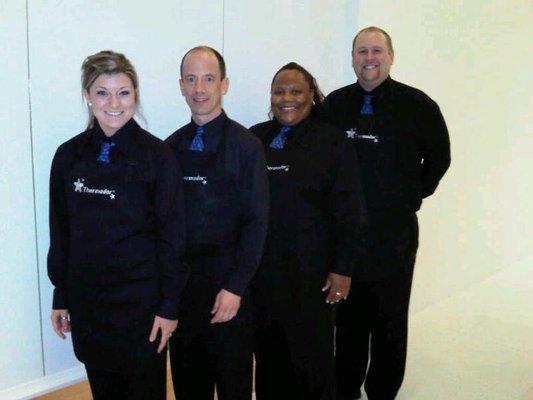 Simply Servers staff outfitted in signature aprons and neckties for a client's event. Don't they look sharp?!