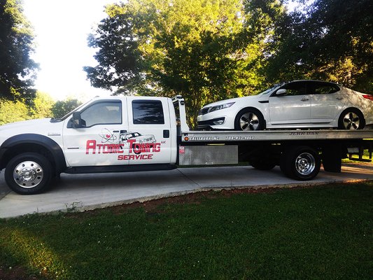 Flat bed tow truck