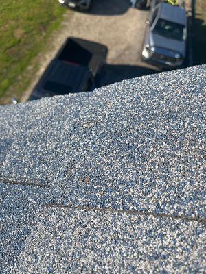 Whenever possible we get on the roof for an up close inspection. Can you see the exposed nail heads? We Can!