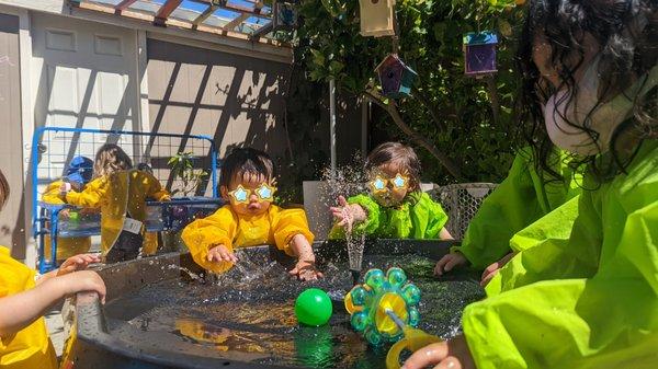 Splashy Waterplay in Sunny Outdoor Learning Area